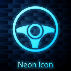 Sticker - Glowing neon Steering wheel icon isolated on brick wall background. Car wheel icon. Vector