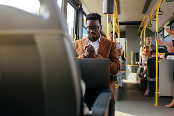 Wall Mural - Black businessman working on commute