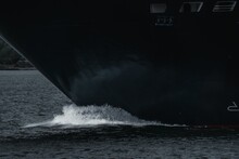 Closeup Shot Of Ship Breaking Ocean Blue Waves At Sea