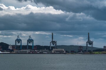 Sticker - View of four ship cranes lifting containers