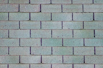 Wall Mural - Surface of old worn asphalt shingles.