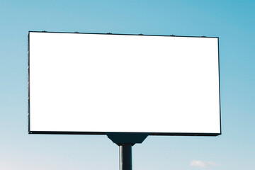 Large white blank billboard for outdoor advertisement, information board on blue sky background