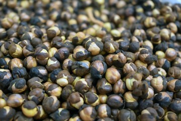 Canvas Print - A Closeup shot of fried chickpeas displayed in a market place