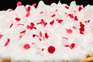 Sticker - Closeup of meringue with heart candies on top of a traditional Swiss sheet cake