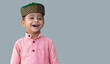© Photix Studio - Muslim kid boy isolated over grey background.
