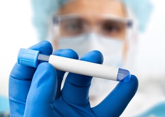 Canvas Print - A medical worker holds a test tube with Monkeypox virus infected blood sample. Epidemic of smallpox monkeys in Europe and the USA.