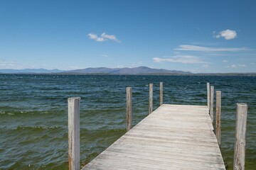 Sticker - Beautiful view of a lake from a wooden deck under the blue sky