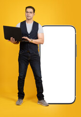 Poster - Great app. Big phone near man. Smartphone with blank white screen. Guy is standing with laptop in his hands. Man with phone for your advertising. Smartphone with place for text. Mobile ads template