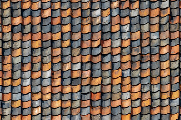 Red tiles background details, Old orange and dark brown roof brick under the sun, Shingles texture, Abstract geometric pattern, Roof top material.