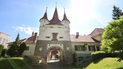 Wall Mural - View of The Catherine's Gate in Brasov, Romania. A lot of greenery in front of it