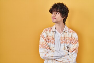 Poster - Young man wearing casual summer shirt smiling looking to the side and staring away thinking.