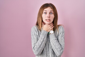 Poster - Beautiful woman standing over pink background shouting suffocate because painful strangle. health problem. asphyxiate and suicide concept.