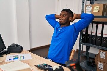 Sticker - Young african american man ecommerce business worker relaxed with hands on head at office