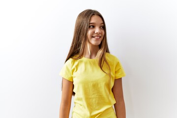 Sticker - Young brunette teenager standing together over isolated background looking away to side with smile on face, natural expression. laughing confident.