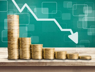 Sticker - Stack of coins bar chart and graph trending downwards. Economy recession crisis, inflation, stagflation, business and financial loss concept.