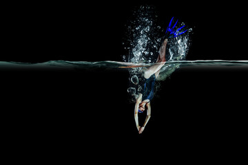 Professional woman swimmer on a wave