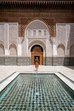 Fototapeta Morze - Woman standing in the Ali Ibn Yusuf mosque and madrasah