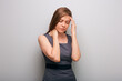 woman with headache touching her head. isolated female business person portrait with deep depression