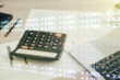 © Pixels Hunter - Double exposure of abstract creative statistics data hologram on calculator and pc background, analytics and forecasting concept