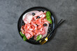 Food antipasti prosciutto ham, parma ham, salami, olives . Charcuterie plate