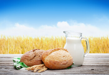 Poster - Homemade bread and milk on wooden table