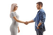© Ljupco Smokovski - Profile shot of a blond woman shaking hand with a casual young man
