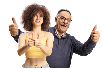 Poster - Cheerful young woman with afro hairstyle and mature man gesturing thumbs up