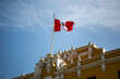 Peru flag waving in the blue sky