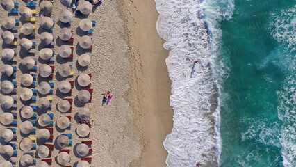 Aerial drone photo of famous bay and organised sandy beach of Livadi Armenistis, popular for surfing sports, Ikaria island, Northeast Aegean, Greece