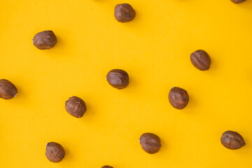 Wall Mural - Hazelnut isolated. Hazelnuts on yellow background. Hazel top view. With clipping path.