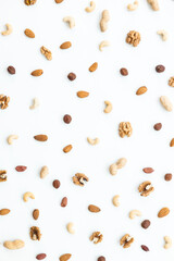 Pattern of nuts mix. Cashew, peanut, hazelnuts, walnuts, almonds on white background