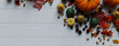© RocknRoller Studios - Fall flat lay with leaves, Gourds and Fruits. Thanksgiving concept with space for text.