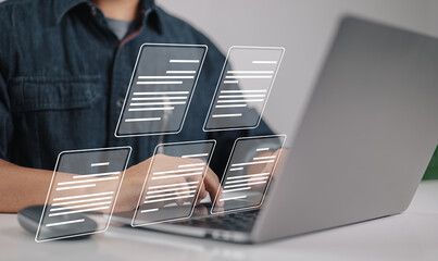 Leinwandbilder - A businessman using a laptop with the idea of a paperless workplace, E-document management, online documentation databases, and electronic document icons.