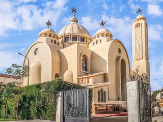 Sharm El Sheikh, Egypt - January 18, 2020: Exterior view of El Sama Eyeen Coptic Orthodox Church in Sharm El Sheikh. Modern religious building with decorative crosses on the background of steel gates