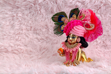 Wall Mural - Bal Krishna Laddu Gopal Brass Statue with beautiful Pink Cloths and Jewelry Krishna Janmashtami