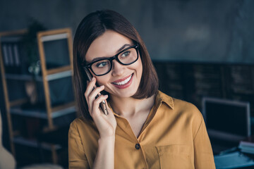 Poster - Portrait of beautiful cheerful girl talking on phone discussing customer care support insurance at workplace workstation indoors