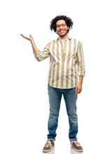 People And Fashion Concept - Happy Smiling Man In Glasses Holding Something On His Hand Over White Background