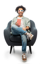 Cinema, Leisure And Entertainment Concept - Happy Smiling Young Man In 3d Glasses With Popcorn Sitting In Chair Over White Background