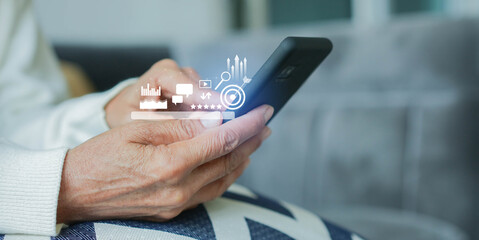 Wall Mural - senior woman hand hold smartphone to use search engine optimization (seo) tools for finding customer