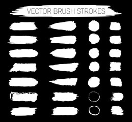 collection of abstract white vector brush strokes on black background