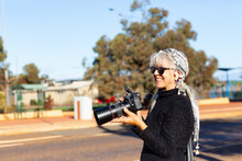 Tourist With Camera At Historic Site