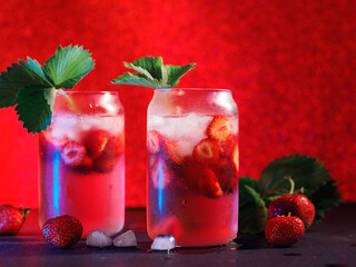 Wall Mural - strawberry cocktail with ice cubes. a refreshing summer drink. decorated with a sprig of strawberrie
