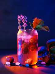 Wall Mural - creative summer refreshing cocktail with strawberries and lavender. blue background