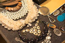 Antiques At Flea Market Or Seasonal Festival - Vintage Jewelry With Pearls, Cameo Necklace And Other Vintage Things. Collectibles Memorabilia And Garage Sale Concept. Selective Focus