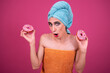 Cheerful drag queen with donuts. Pink background.	