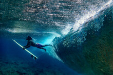 Underwater View Of Male Surfer Making Duck Dive