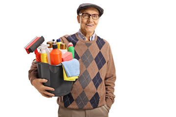 Sticker - Elderly man holding a bucket with cleaning supplies and smiling