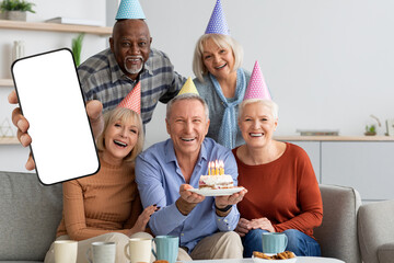 Poster - Group Of Happy Senior People Celebrating Birthday And Demonstrating Big Blank Smartphone