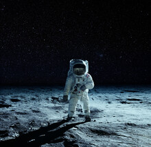 Astronaut At The Spacewalk On The Moon. National Moon Day. Elements Of This Image Furnished By NASA.