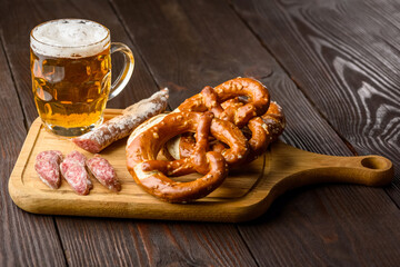 traditional mug of beer, pretzels and fuet sausage